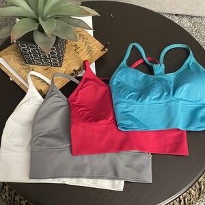 NWOT. Set of 4 sports bras